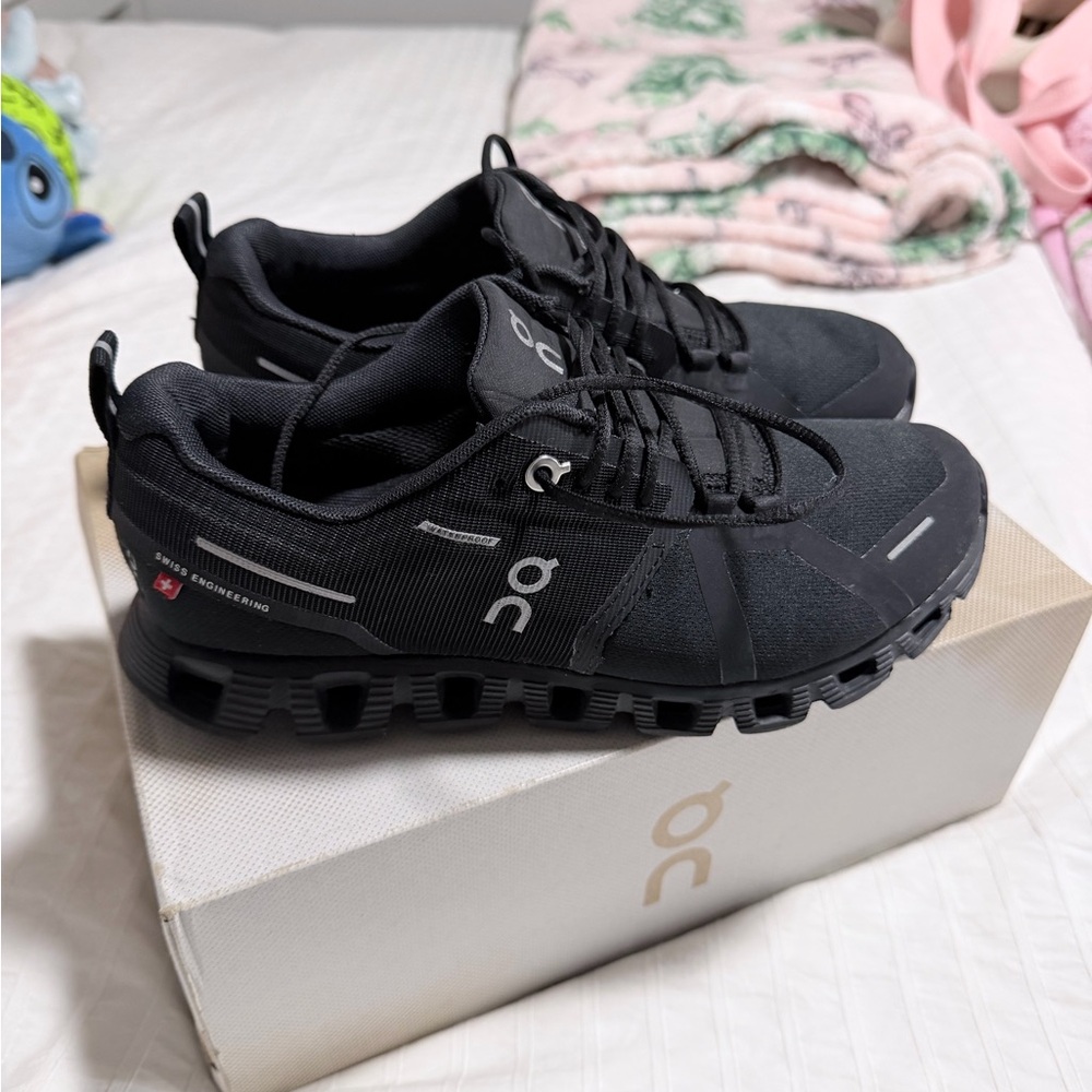 On Running All-Black Athletic Shoes